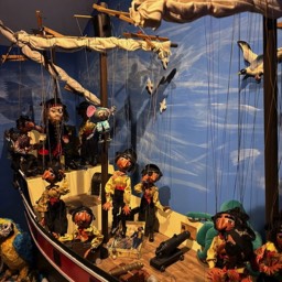 A picture of a Pellam Puppet pirate boat with pirates and mice.