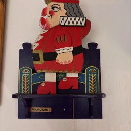 A picture of a Mr Punch wooden mural toy